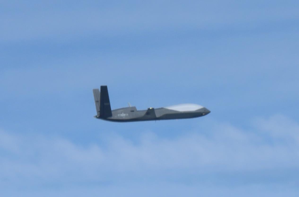 drone flying over hilly highway corridor